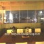 Unobstructed View by Frameless Door Leaving Wide Full City Night Scene As Beautiful Picture. With Aircon Turn On Inside Living Room